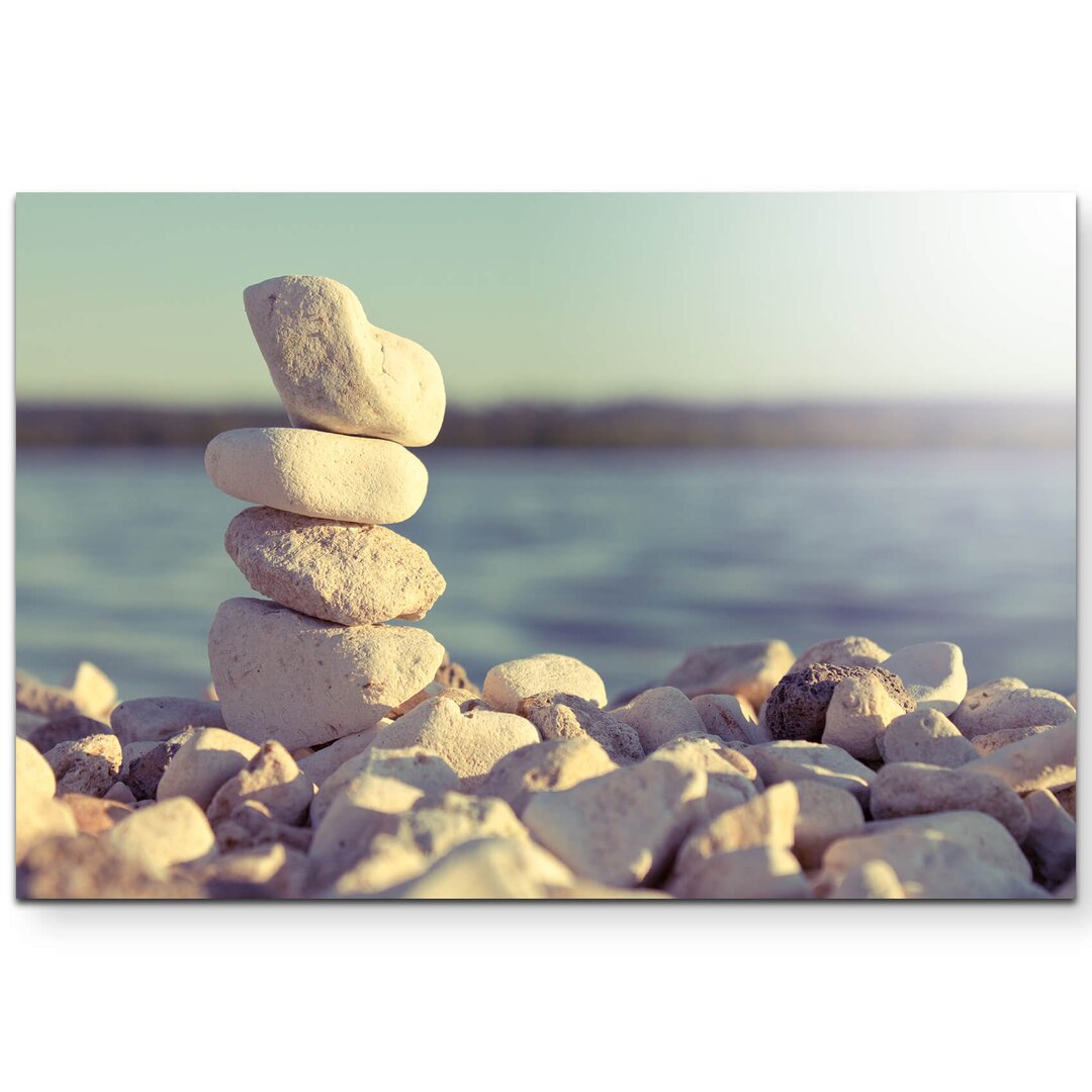 Leinwandbild Turm aus Steinen am Meer