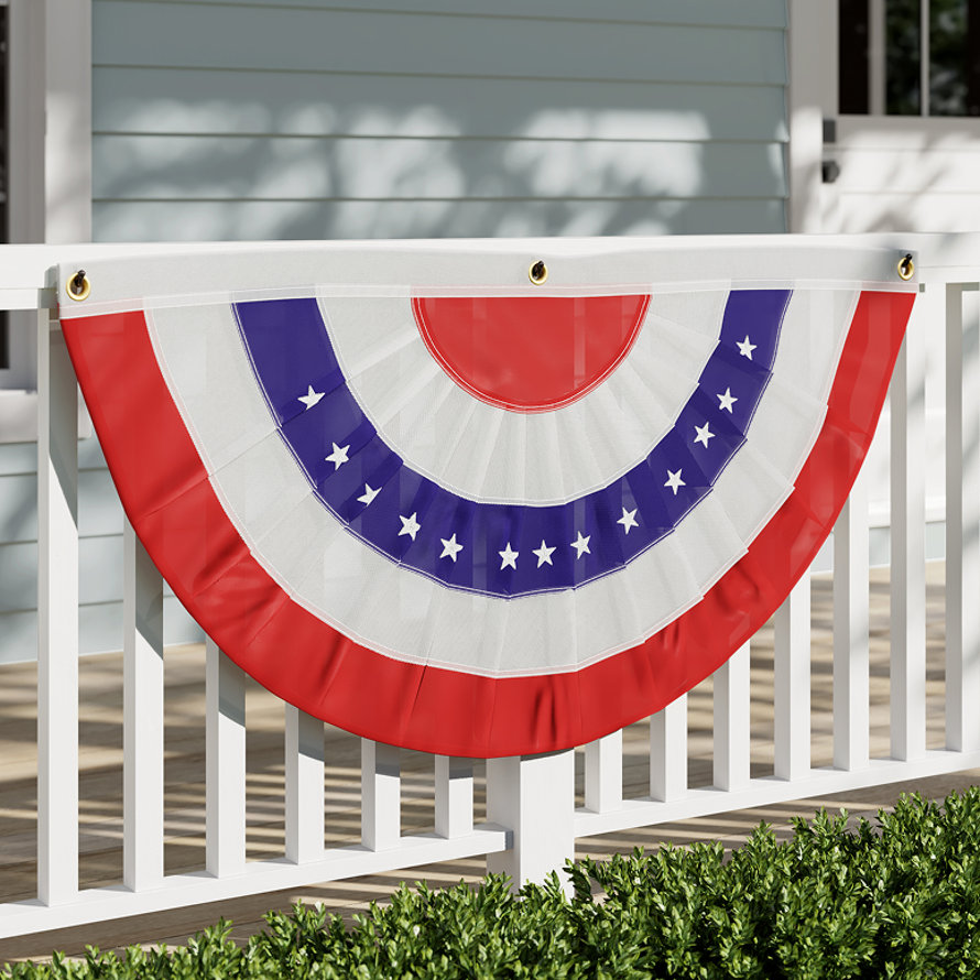 Red, white, and blue patriotic bunting on a white porch railing