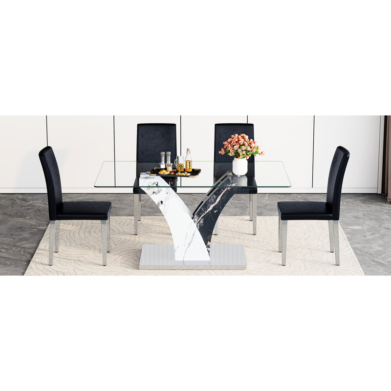 Salle à manger moderne avec table en verre transparent, pieds et 4 sièges en polyuréthane noir, pieds en métal argenté - insert de rembourrage en éponge, surface de groupe de la table de la structure, rembourrage souple et élastique, conception stable