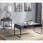 Table basse industrielle en béton gris et noir avec rangement inférieur, structure en métal stable pour le salon