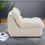 Canapé beige moderne avec structure en métal, salon confortable et compact pour la maison ou le bureau