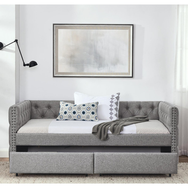 Twin sized upholstered daybed featuring two drawers, adorned with buttons and copper nails on its square arms, Grey