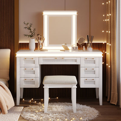 Coiffeuse de 122 cm avec miroir et éclairage, armoire de maquillage avec 7 tiroirs et tabouret rembourré, table de toilette avec tiroir ajouré pour chambre à coucher, pieds en bois d'hévéa