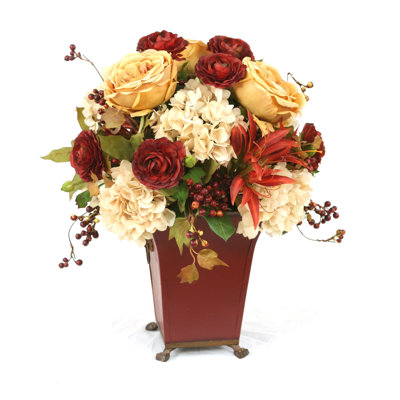 Or antique, rouille, rouge, mélange de vert et de brun dans un pot à fleurs