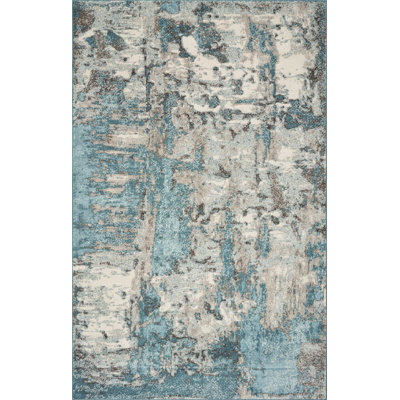 Tapis ivoire / bleu sarcelle tissé à la machine Rizac