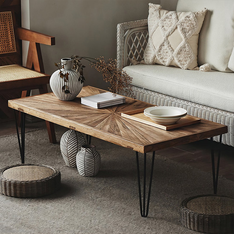 Table basse brune et noire en bois massif et fer
