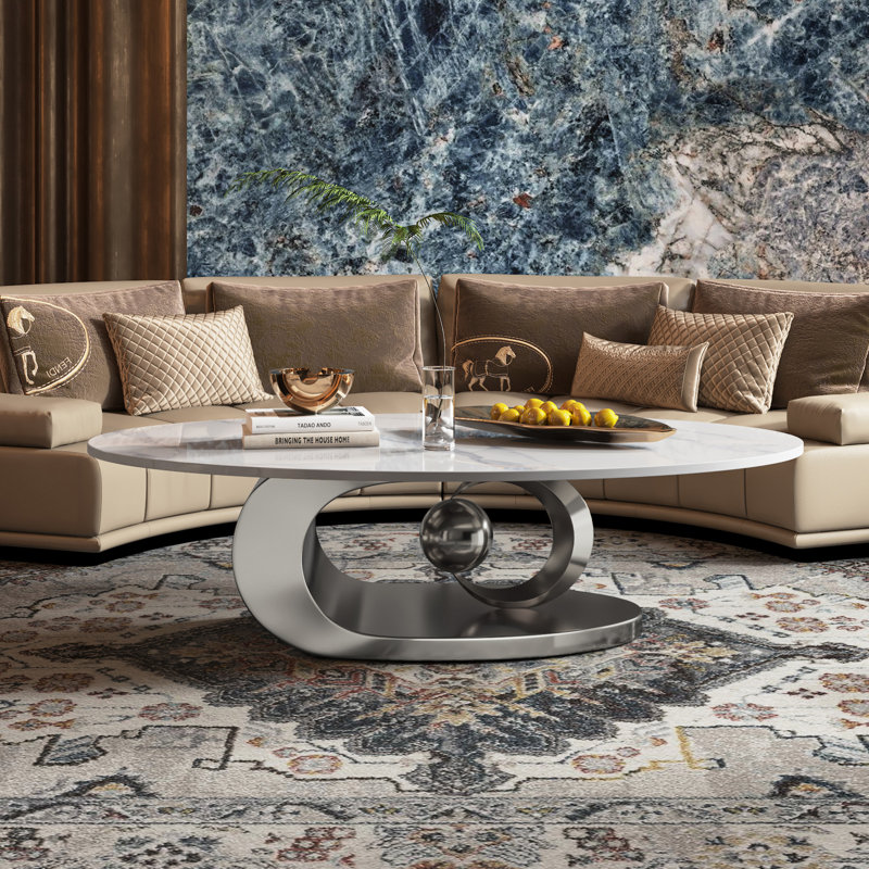 49.2" Oval Coffee Table with Faux Marble Top, Silver Stainless Steel Base with Abstract Fantastic Midsize Sphere Crescent-Shaped Design