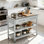 Îlot de cuisine avec plateau en acier inoxydable, tablettes ouvertes à 2 niveaux et tiroirs, gris clair