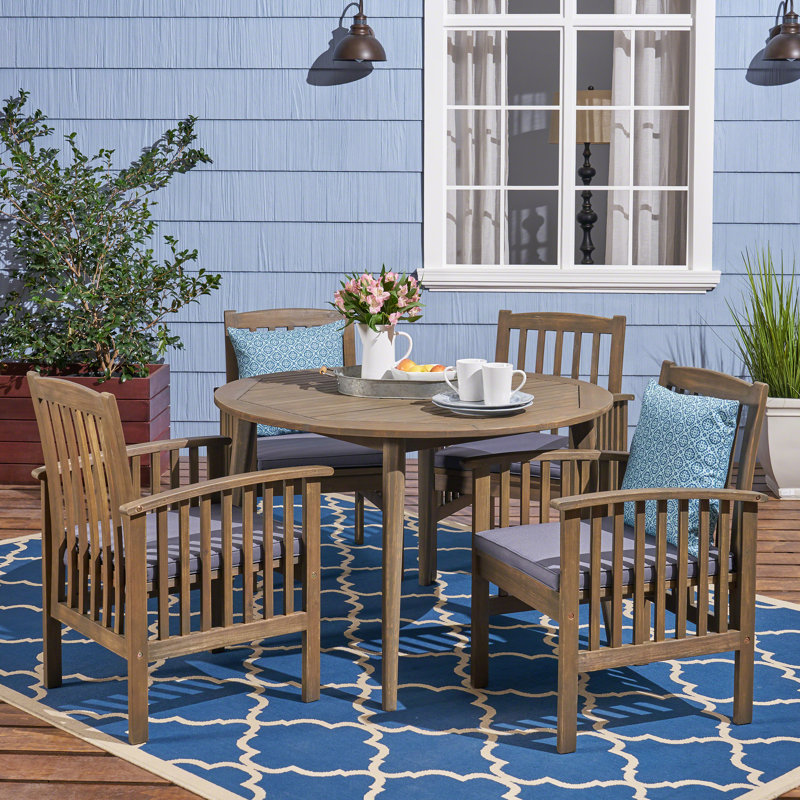 Tinnin 4 - Person Acacia Wood Patio Dining Set with Round Table , Cushions Included, Purple