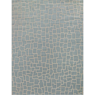 Tapis bleu et ivoire de haute qualité noué à la main