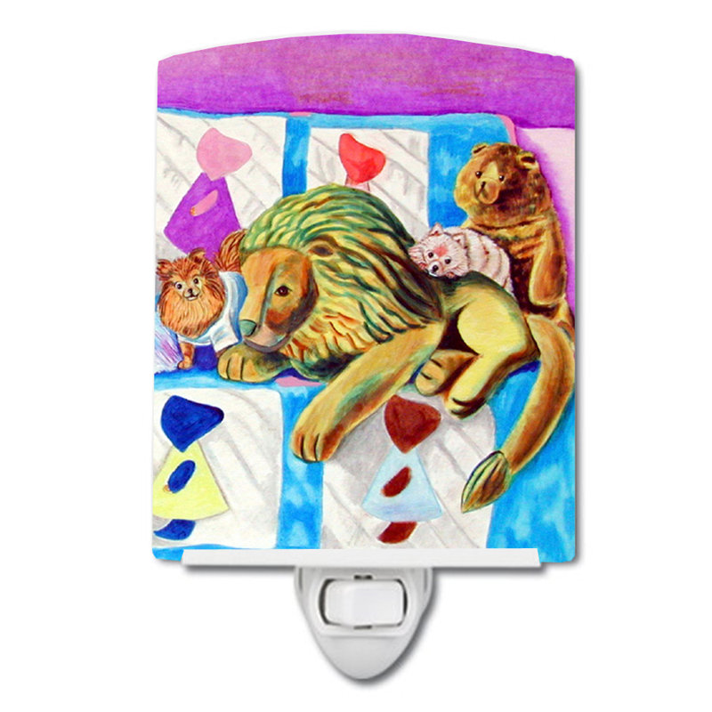 Poméranie sur le canapé avec éclairage de nuit en céramique de tiger de jouets