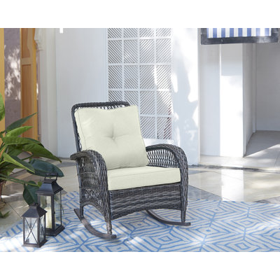 Chaise berçante de patio avec coussins en polyester Fruttuo