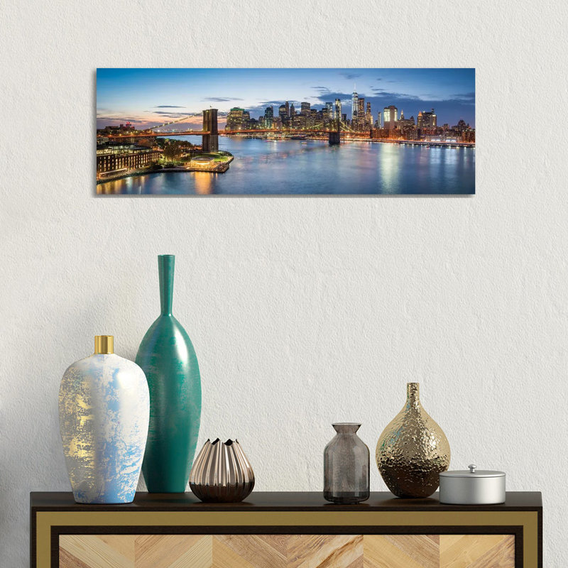 Elevated View Of The Manhattan Skyline With Brooklyn Bridge by Jan Becke - Wrapped Canvas Panoramic Print