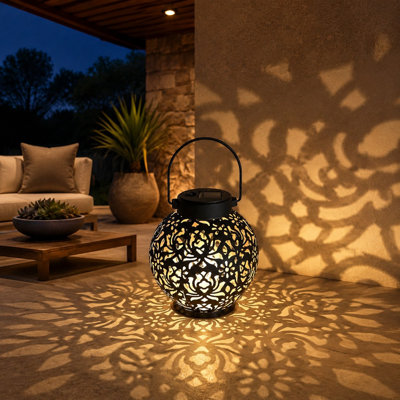Gardens, patios, courtyards, lawns, and tabletops can be decorated with this 2 Pack of solar hanging lanterns, made from Metal in an Antique Bronze finish.