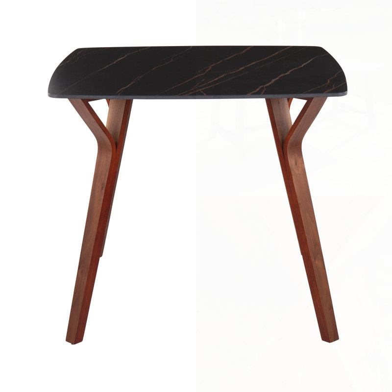 Élégante table de salle à manger en bois de noyer et marbre texturé noir, parfaite pour les espaces de repas et de divertissement modernes.