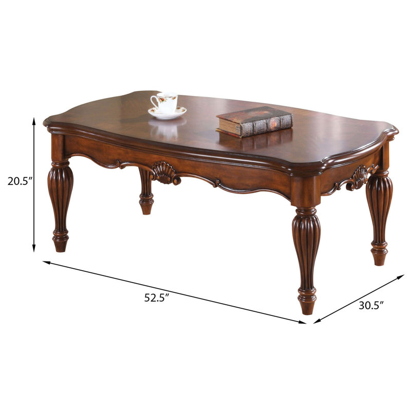 Table basse en cerisier rectangulaire avec pieds tournés, parfaite pour un décor de salon élégant et fonctionnel.