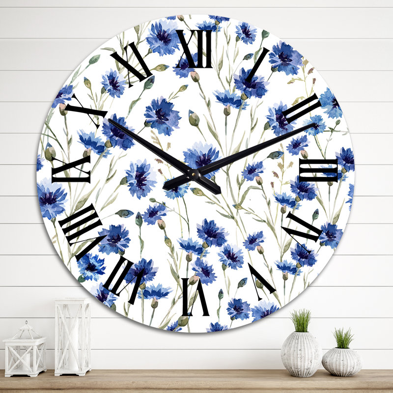 Horloge murale à fleurs bleues sur fond blanc, Moyen