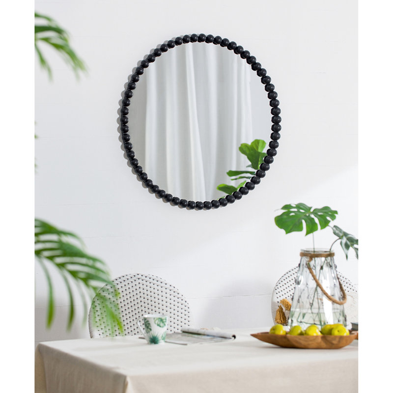 Le miroir mural de salon en métal à cadre perlé ajoute du style de chambre à coucher