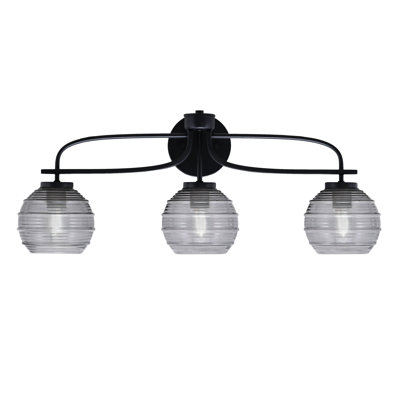 Barre d'éclairage de salle de bain 3 lumières Ayrton Cavella, fini noir mat avec verre nervuré de 6 po