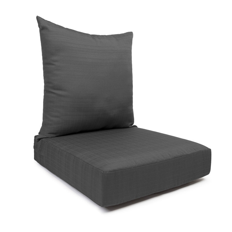 Coussin de siège avec fermeture à glissière et coussin de dossier séparé, avec rembourrage en polyester blanc.