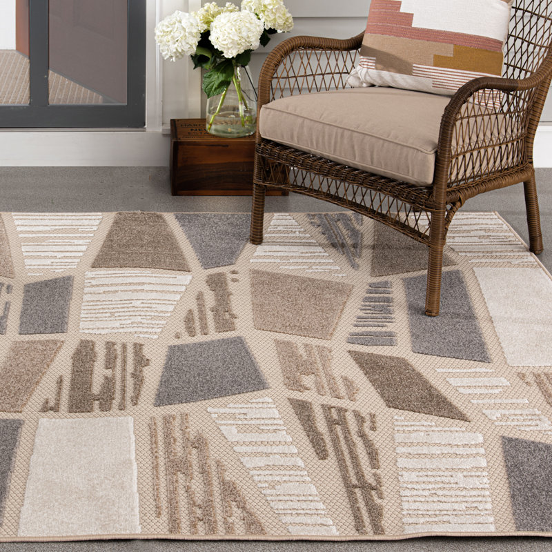 Ivory and Taupe Geometric 5' x 7' Synthetic Area Rug