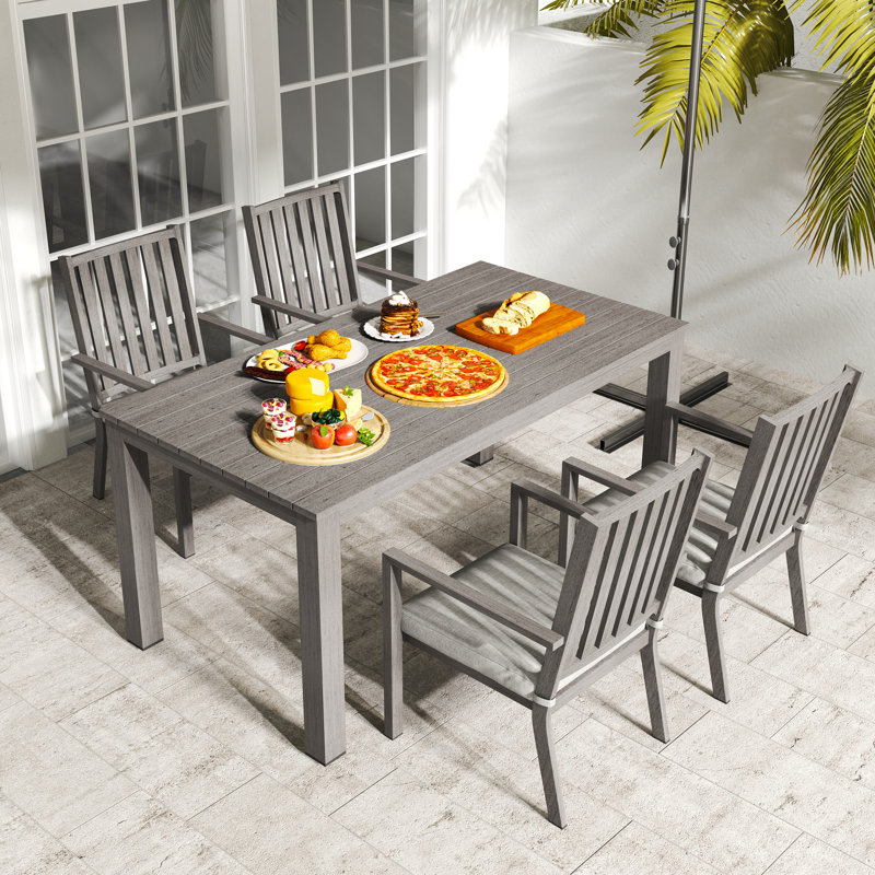 Deidre 4 - Person Patio Dining Set with Rectangular Table , Cushions Included, Gray