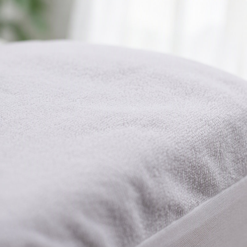 Protège-matelas hypoallergénique en tissu éponge bouclé avec barrière hydrofuge