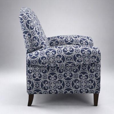 Luxueux fauteuil inclinable avec dossier à dos de chameau haut, accoudoirs roulés et motif de chantournage pour une décoration intérieure élégante