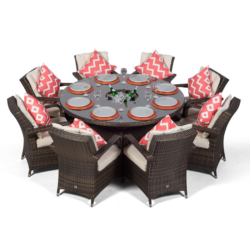 Karas 8 - Person Wicker Patio Dining Set with Round Table , Cushions Included, Brown