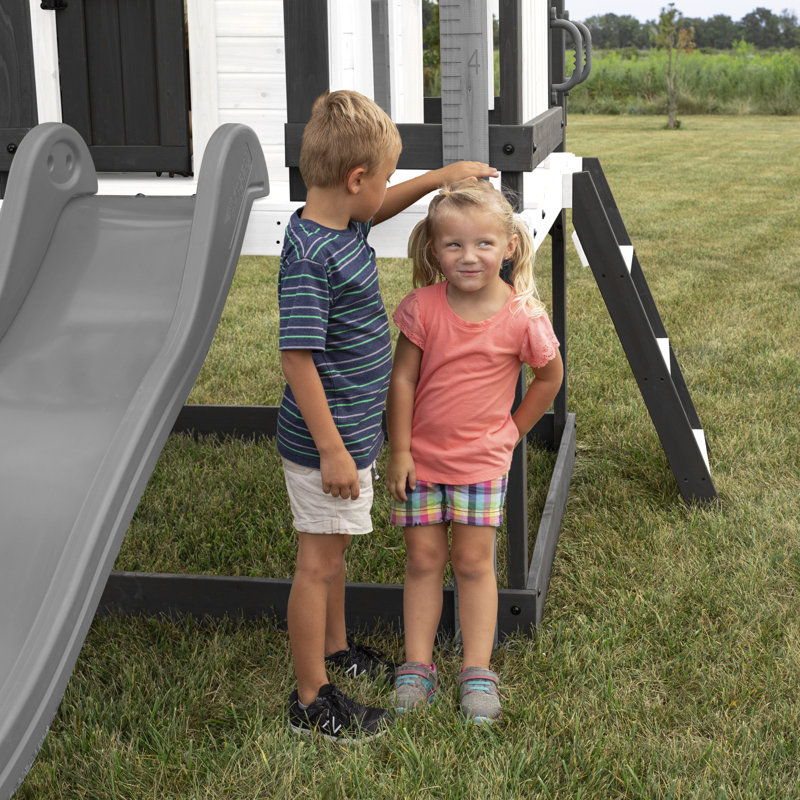 Backyard Discovery Sweetwater Heights White Cedar Wooden Elevated Kids Playhouse with Wave Slide, Play Kitchen, and Deck