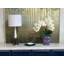 Orchid Arrangement In A Ceramic Vase With Leaves