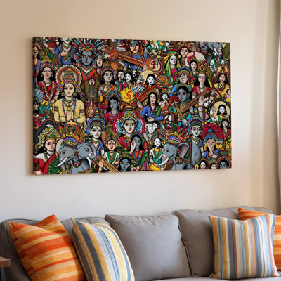 La toile crée un motif vibrant et complexe mettant en vedette un collage d'art mural avec des motifs et des chiffres indiens traditionnels, y compris un art mural sur toile coloré