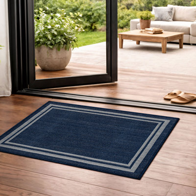 Tapis intérieur / extérieur tissé à plat en jute bleu marine / ivoire Border