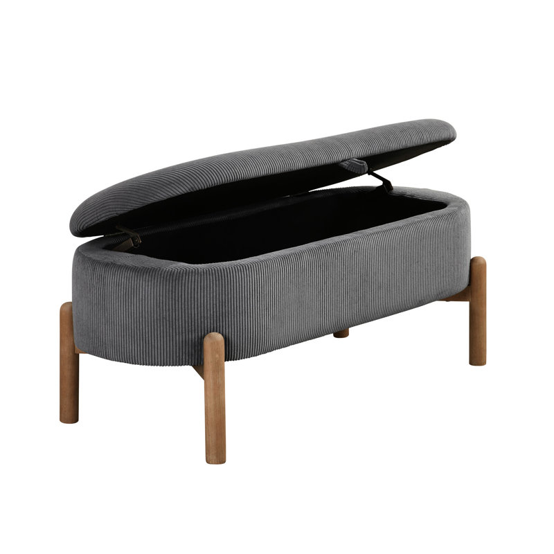 Banc de rangement élégant en velours côtelé gris avec des pieds en bois massif et une base polyvalente d'inspiration Mid-Century