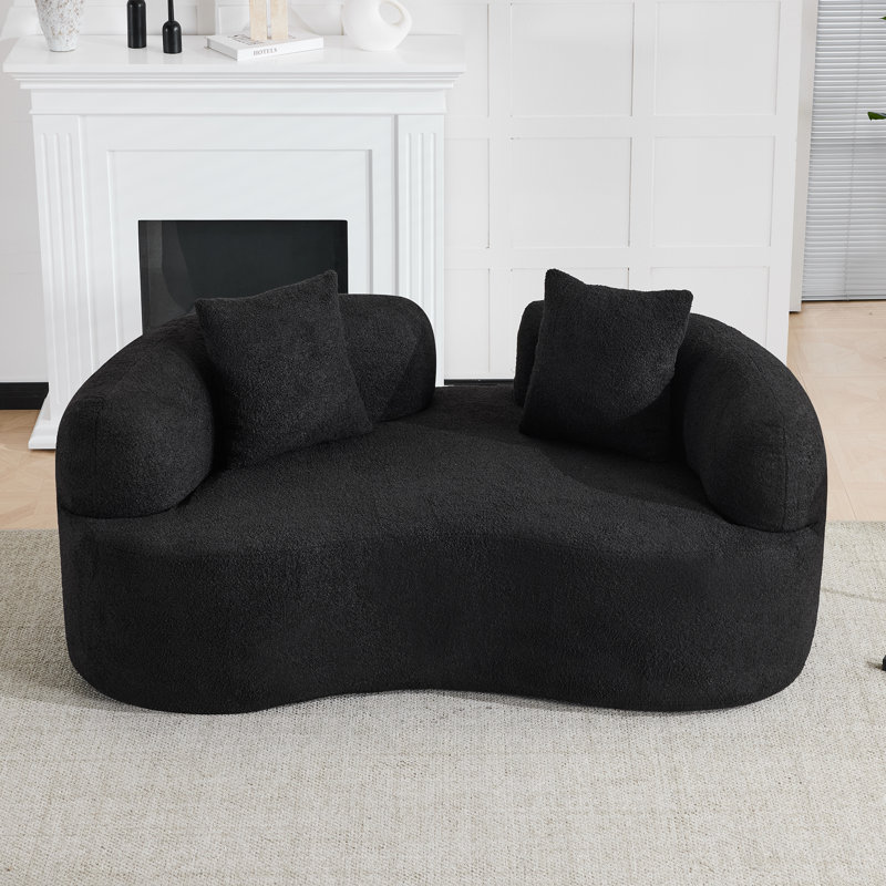 Canapé compact et moderne noir, en mousse et en velours, idéal pour les petits espaces