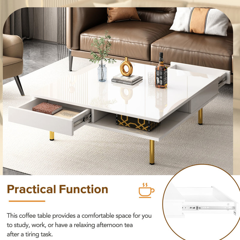 Table basse blanche avec 4 pieds dorés et 2 tiroirs pour plus de confort