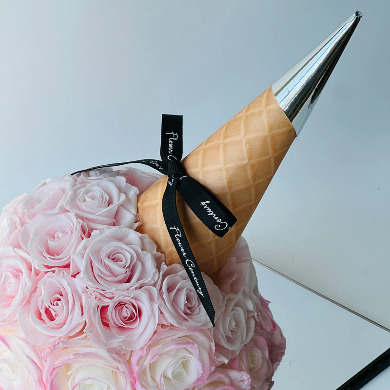 Arrangement de roses en boîte