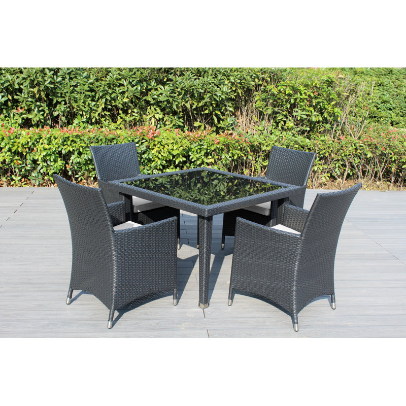 Lumini 4 - Person Wicker Patio Dining Set with Square Table , Cushions Included, Canvas Natural Sunbrella® Canvas