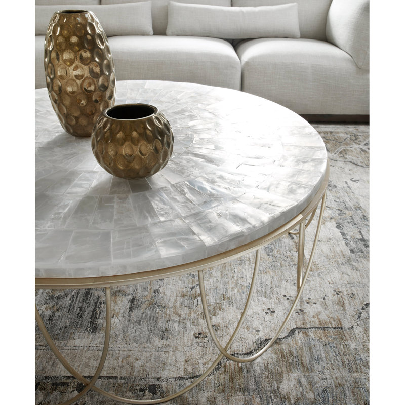Round Stone Top Cocktail Table With Decorative Metal Base