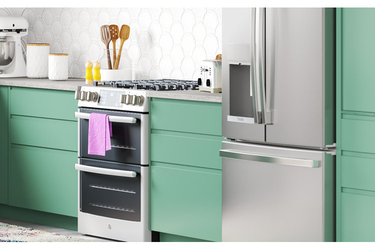 green modern kitchen with kitchen appliances