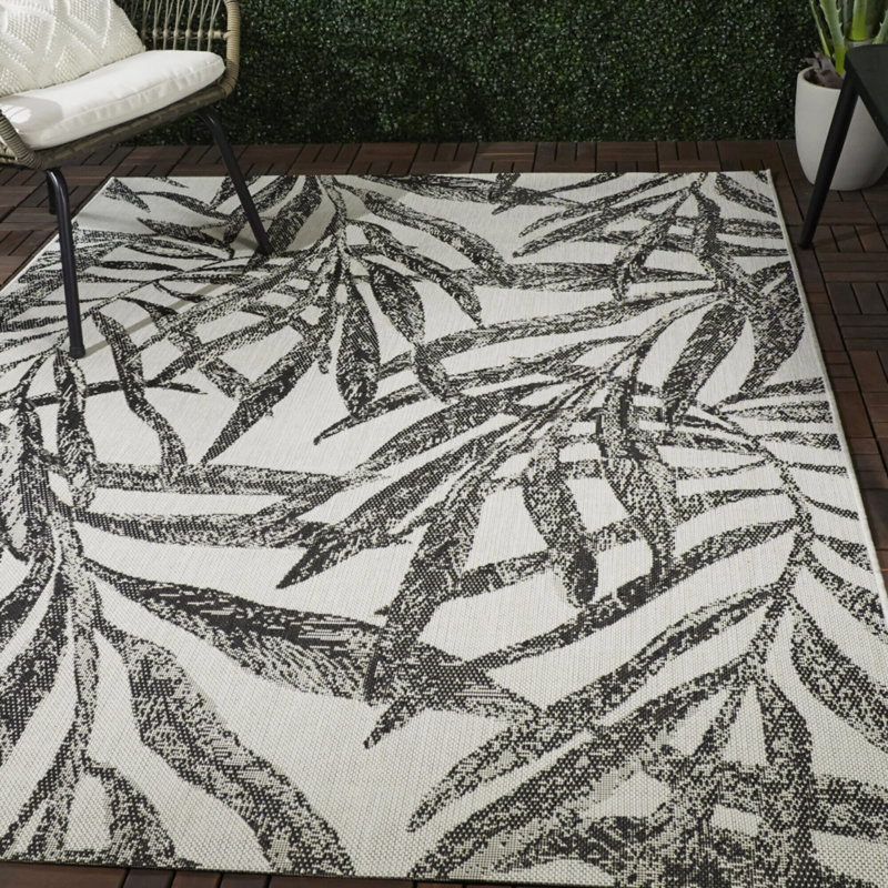 Abeles Cream/Black Tropical Leaves Indoor/Outdoor Area Rug