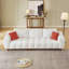 Canapé convertible modulaire avec repose-pieds mobile et coussins décoratifs, parfait pour le confort et le style de tout salon.
