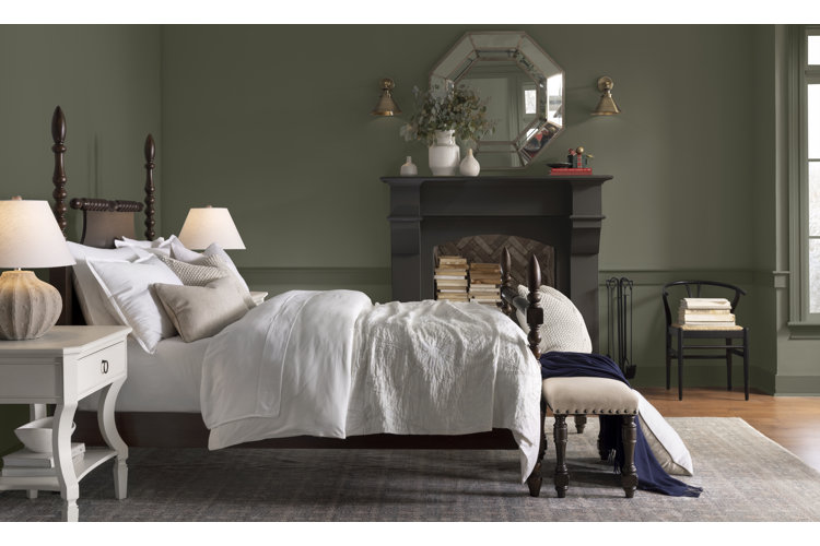 traditional-style bedroom with olive green paneled walls