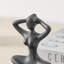 Ensemble de 3 poses de sculpture en métal brun foncé en fonte