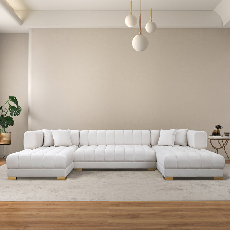 Canapé modulaire capitonné avec repose-pieds