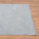 Tapis texturé à franges