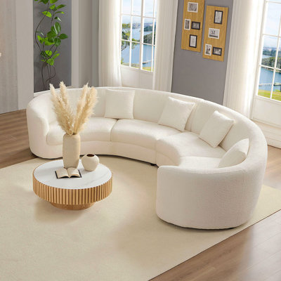 Comfortable Curved Sofa with Soft Upholstery and Multiple Pillows for Living Room