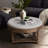 Large round ottoman coffee table in light grey, 2-tier design with button tufted top & wood storage shelf