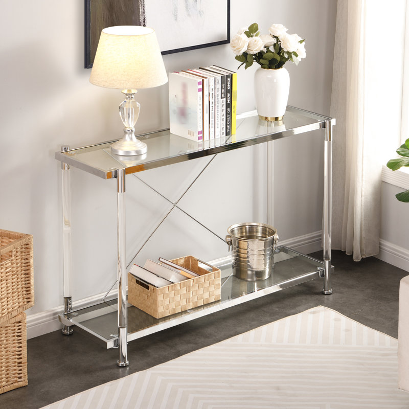 Table d'appoint en acrylique de 112 cm (44,04 po) avec structure en métal et 2 tablettes en verre, idéale pour le salon et la chambre. Pieds en verre.