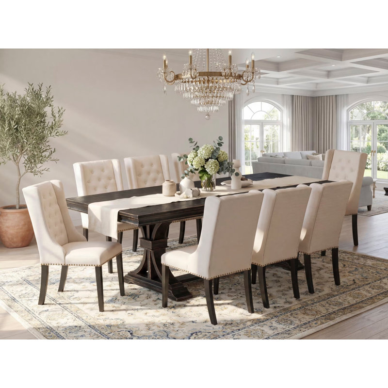 L'ensemble de salle à manger 9 pièces comprend une table rectangulaire et 8 chaises de salle à manger en tissu de lin crème avec dossier capitonné - noir sablé.